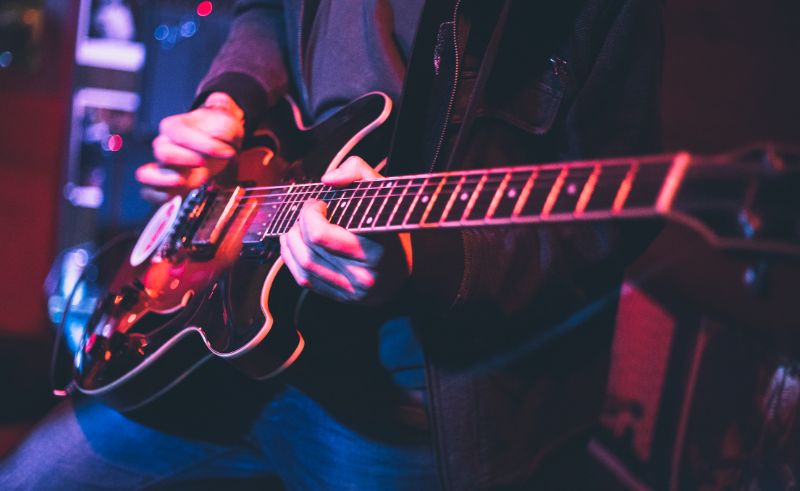 electric guitar player on a stage