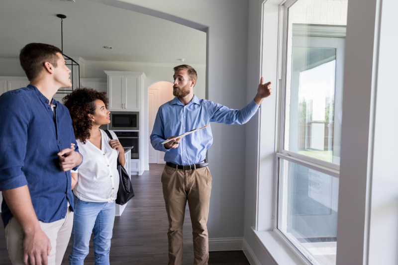 couple talking to a real estate agent