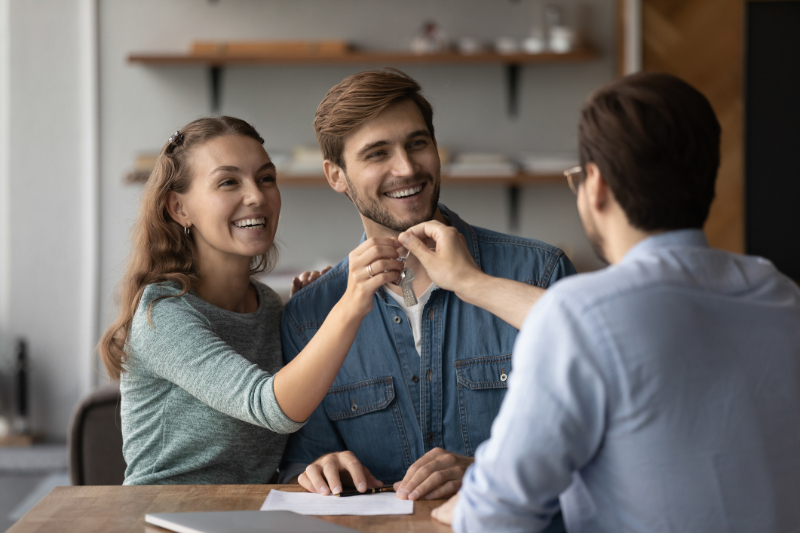 couple signing contract for new house